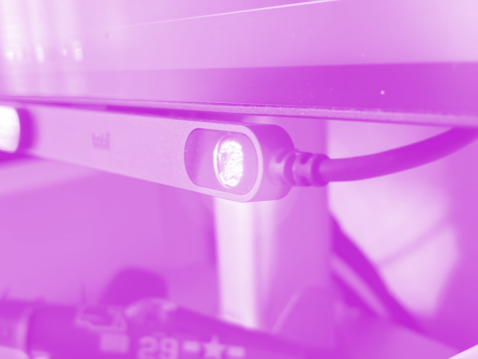 The Tobii sits flush under the screen and is held in place by a magnetic mount.